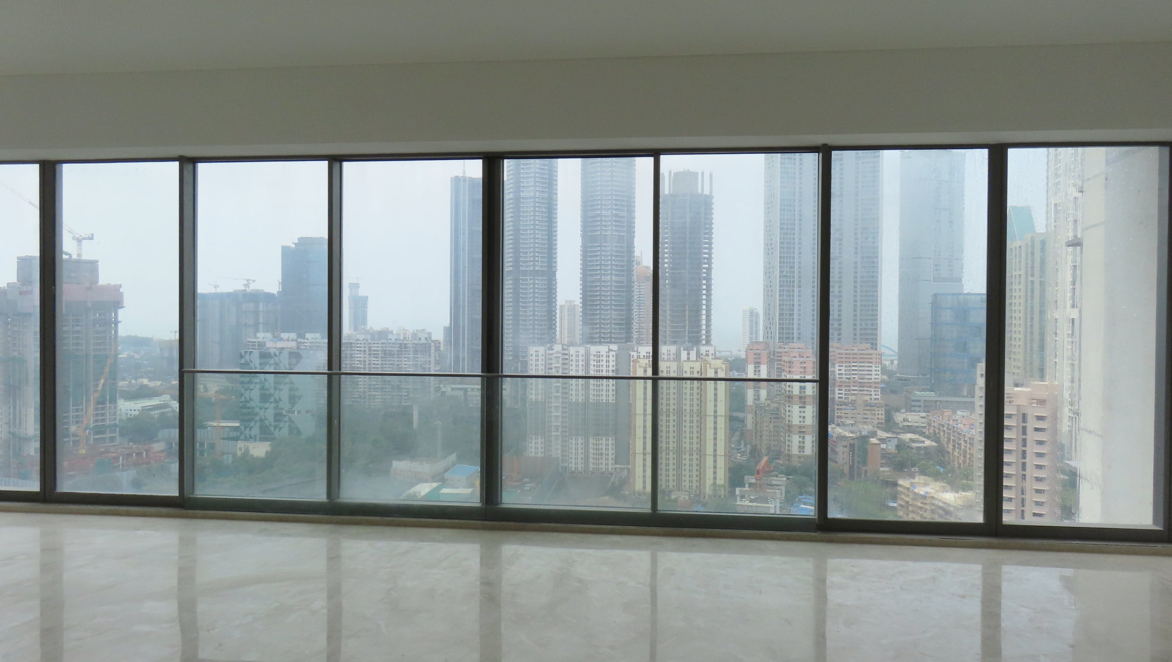 High-rise towers in Mumbai featuring modern window façades and architectural design.