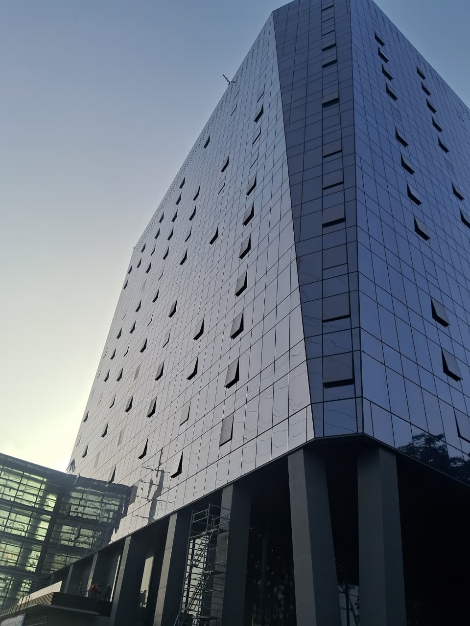 Modern glass façade of Atrium Place Gurugram, a Grade A office development by Hines showcasing high-performance building envelope engineering.