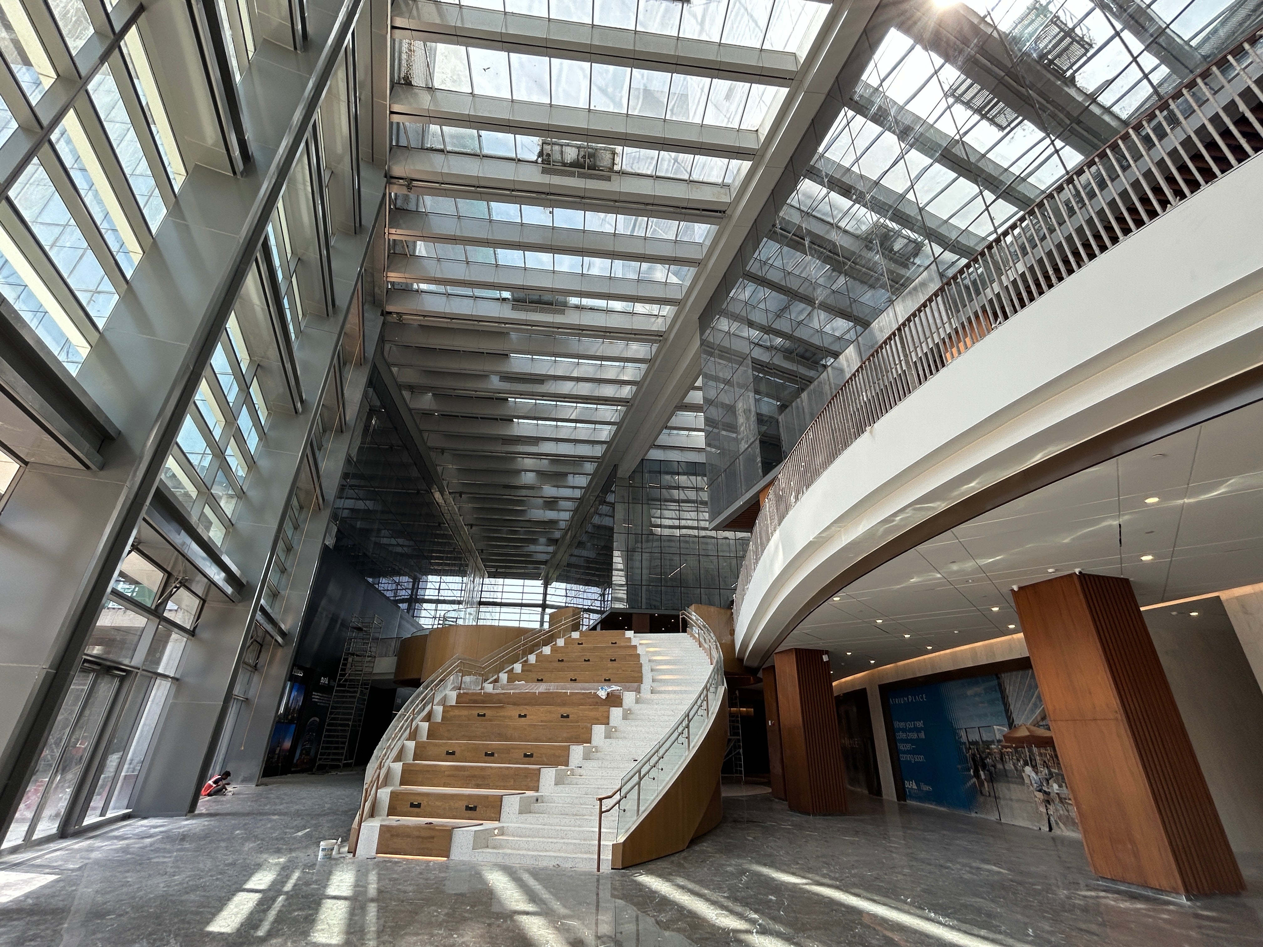 Modern glass façade of Atrium Place Gurugram, a Grade A office development by Hines showcasing high-performance building envelope engineering.